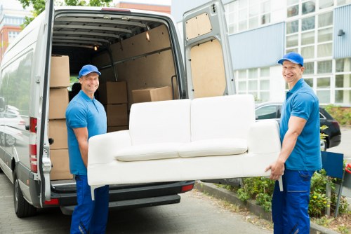 Removalists loading household furniture outside a Kennington home
