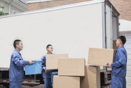 Business office furniture being arranged at a new Kennington workplace