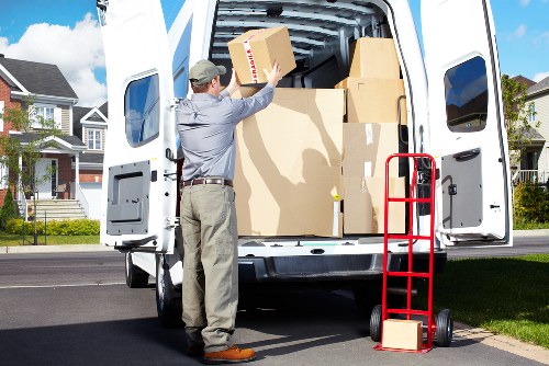 Packed office boxes and labelled items ready for commercial removals