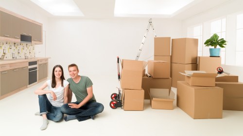 Local movers handling boxes and furniture during a Kennington relocation