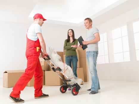 Packing boxes and furniture for a home removal service